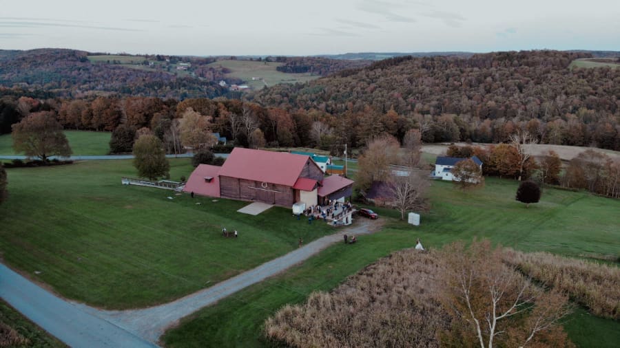 Aerial view of The Barn on Hubbard surrounded by rolling hills.