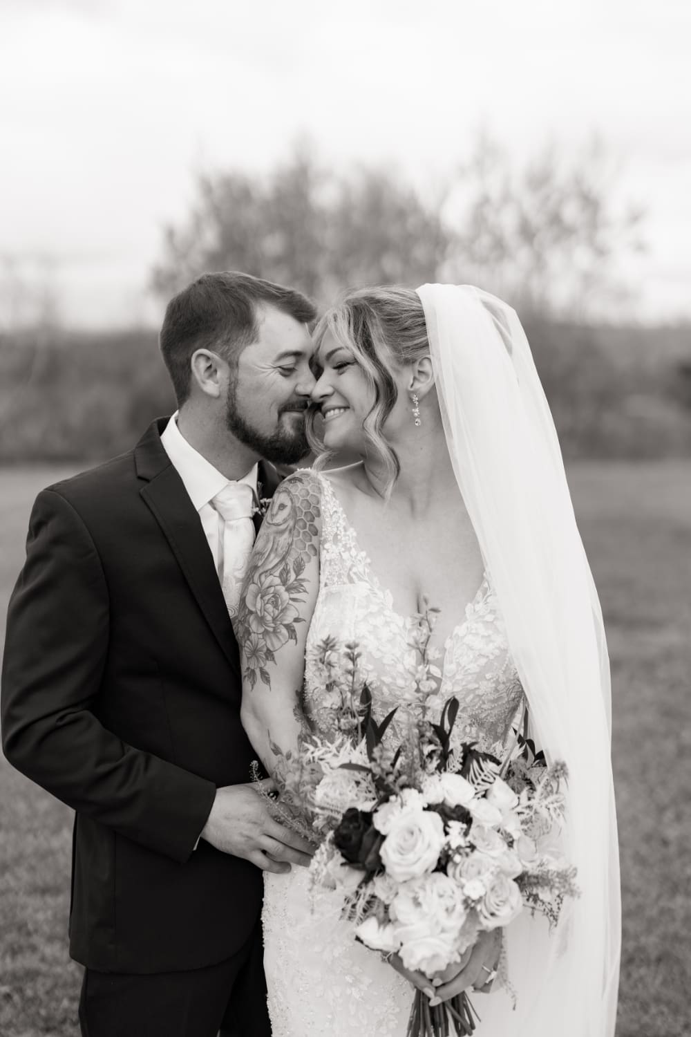 A quiet moment between the couple captured in black and white. Lace details, a beautiful bouquet, and genuine smiles. The right photographer on your wedding vendor list makes all the difference.