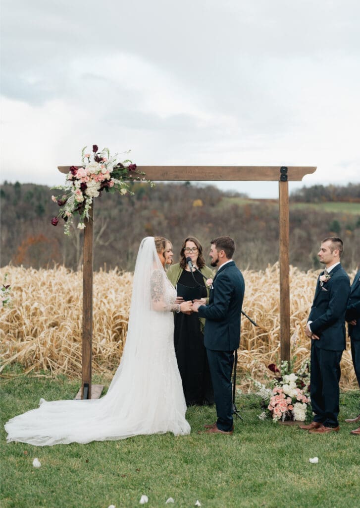 Outdoor fall wedding ceremony in the Catskills showcasing why autumn is the best season to get married.
